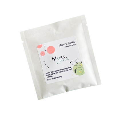 A packaged Blyss Bursts cherry bomb matcha powder mix with branding and flavor information on the front.